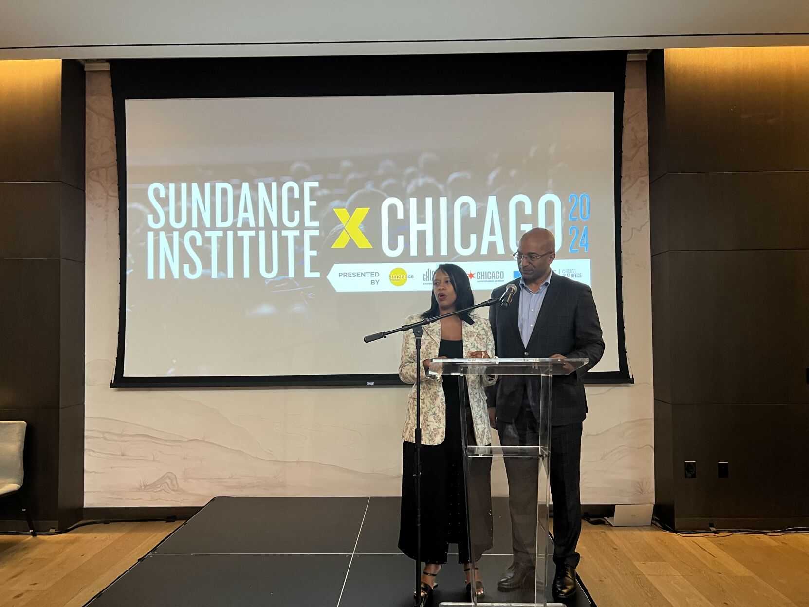 Clinee Hedspeth (President/CEO Dept. of Cultural Affairs and Special Events, DCASE) and Rich Gamble (Interim CEO Choose Chicago) welcome guests to Sundance X Chicago's opening night reception at The Study at University of Chicago. (Photo | Candace Jordan)